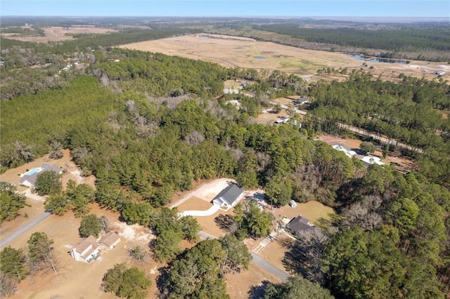 bird's eye view with a forest view