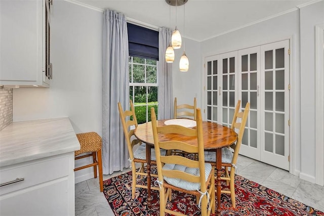 dining space with crown molding