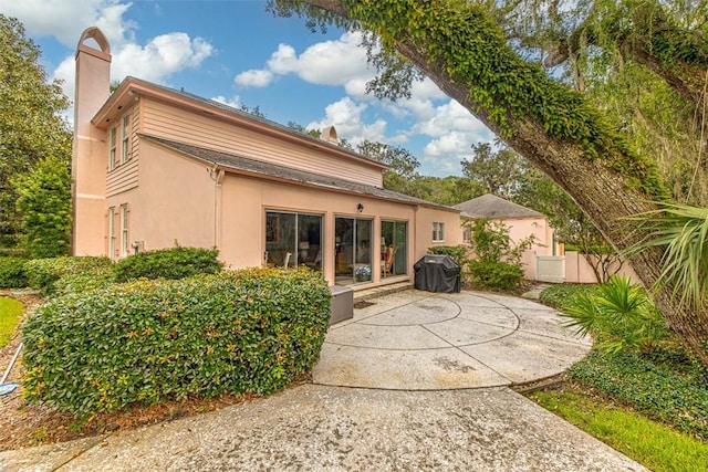 rear view of house featuring a patio