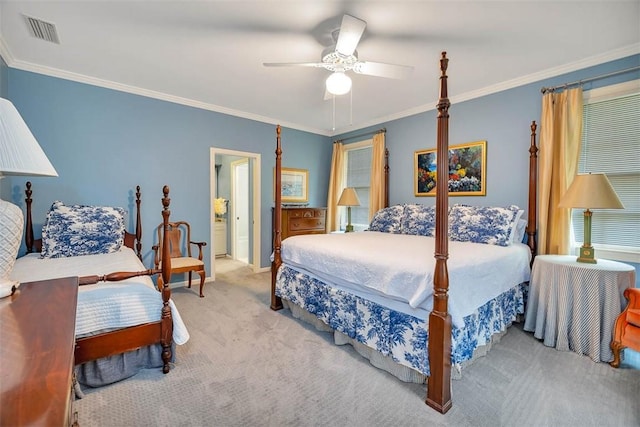 carpeted bedroom featuring ceiling fan, ensuite bathroom, and ornamental molding