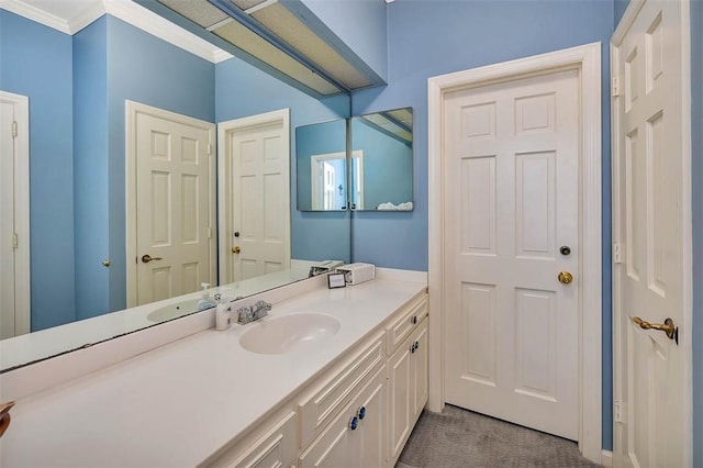 bathroom with vanity and crown molding