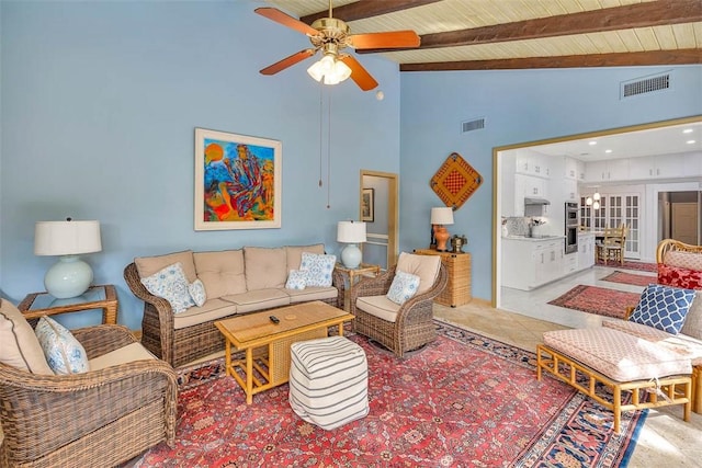 living room featuring beamed ceiling, tile patterned flooring, high vaulted ceiling, and ceiling fan