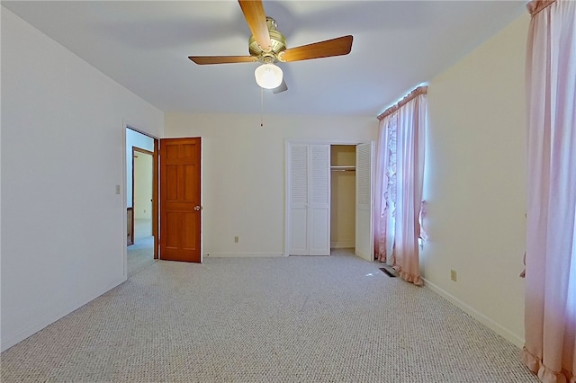 6116 E Main St, Patterson, GA 31557 - unfurnished bedroom featuring light colored carpet, baseboards, a ceiling fan, and a closet