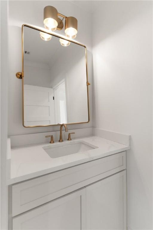 bathroom featuring visible vents and vanity
