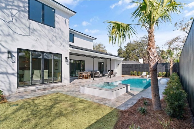 view of swimming pool featuring ceiling fan, a patio area, a fenced in pool, a fenced backyard, and a yard