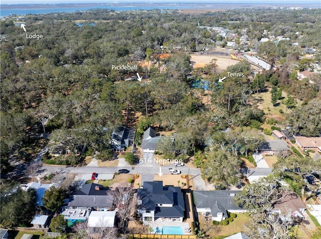 drone / aerial view with a water view and a residential view