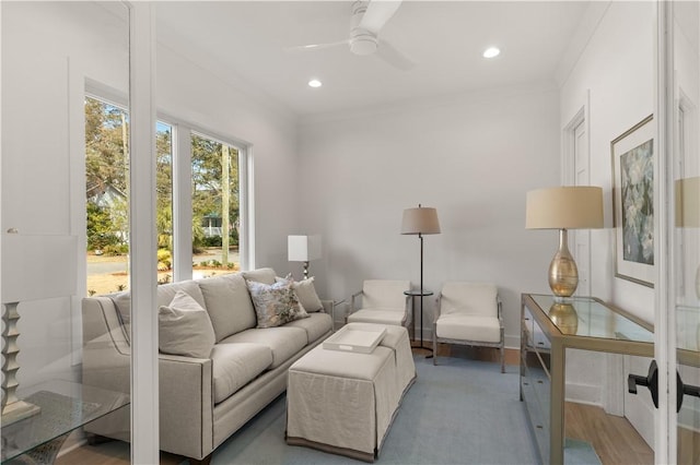 living area featuring recessed lighting, ceiling fan, and ornamental molding