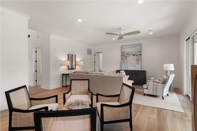 living room featuring recessed lighting, ceiling fan, and light wood-type flooring
