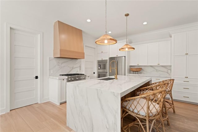 616 Neptune Way, Saint Simons Island, GA 31522 - kitchen featuring premium range hood, stainless steel appliances, tasteful backsplash, light wood-style floors, and recessed lighting