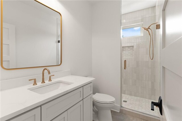 616 Neptune Way, Saint Simons Island, GA 31522 - full bath featuring toilet, a shower stall, vanity, and tile patterned flooring