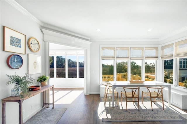 sunroom featuring breakfast area and plenty of natural light