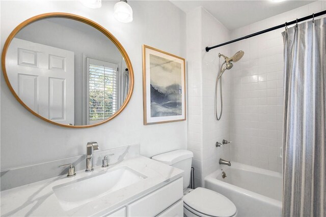 bathroom featuring vanity, walk in shower, and toilet