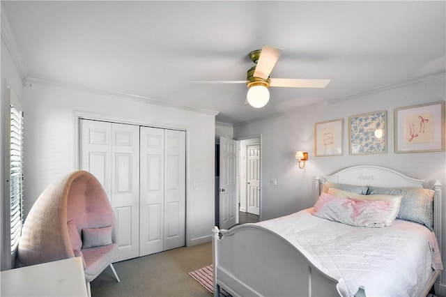 carpeted bedroom with crown molding, a closet, and ceiling fan