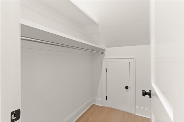 spacious closet featuring light wood finished floors