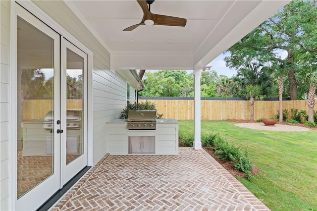 view of patio / terrace with a grill, area for grilling, french doors, and a ceiling fan