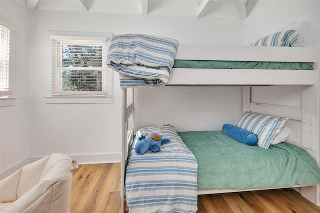 bedroom with wood-type flooring