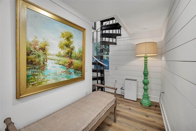 bedroom with light hardwood / wood-style flooring and crown molding