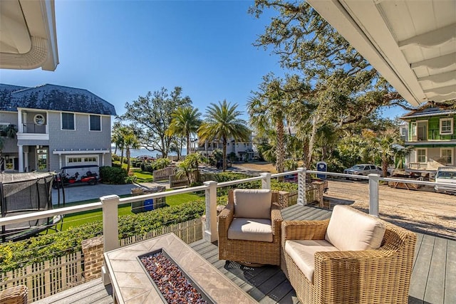 deck with an outdoor fire pit