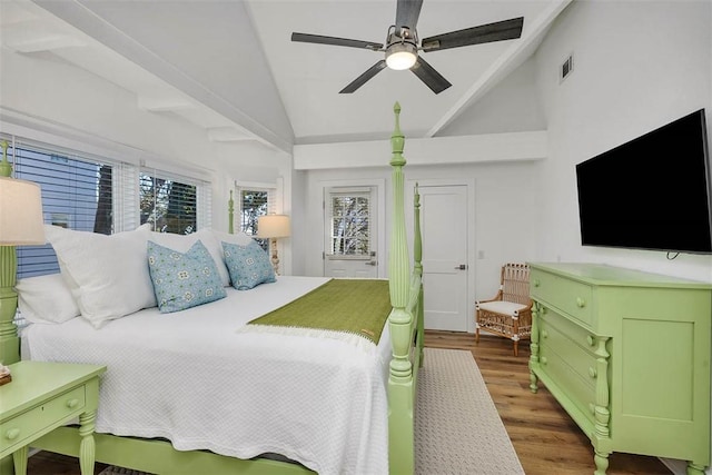 bedroom with ceiling fan, lofted ceiling, dark wood-type flooring, and multiple windows