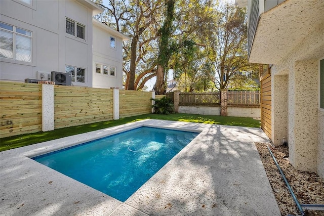 view of pool featuring ac unit and a patio