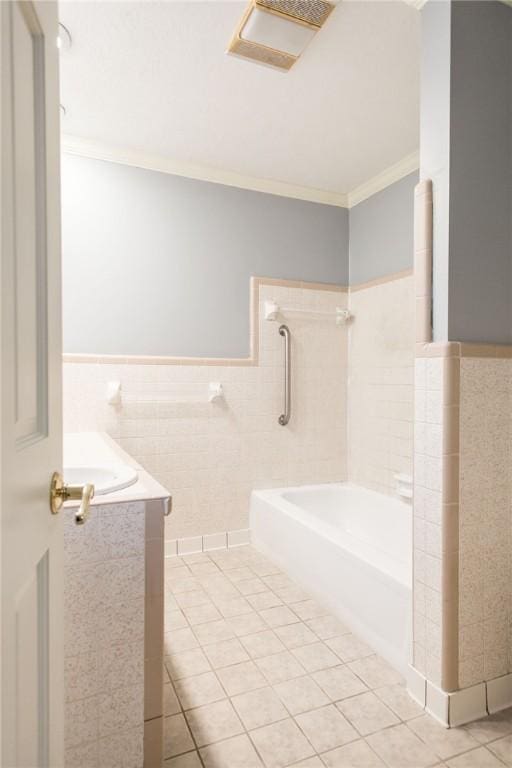 1878 Blalock Ave, Waycross, GA 31503 - full bathroom featuring tile patterned floors, crown molding, tile walls, and a wainscoted wall