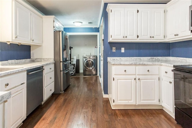 1878 Blalock Ave, Waycross, GA 31503 - kitchen featuring stainless steel appliances, washing machine and clothes dryer, white cabinets, dark wood-style floors, and ornamental molding