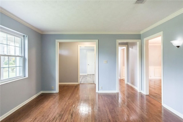 1878 Blalock Ave, Waycross, GA 31503 - unfurnished room with wood finished floors, baseboards, and crown molding