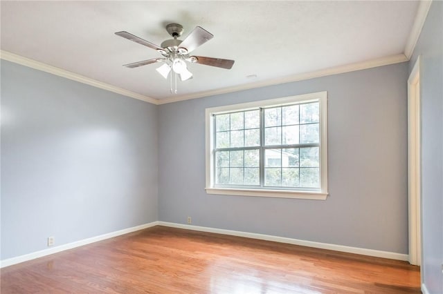 1878 Blalock Ave, Waycross, GA 31503 - empty room with ornamental molding, wood finished floors, baseboards, and a ceiling fan