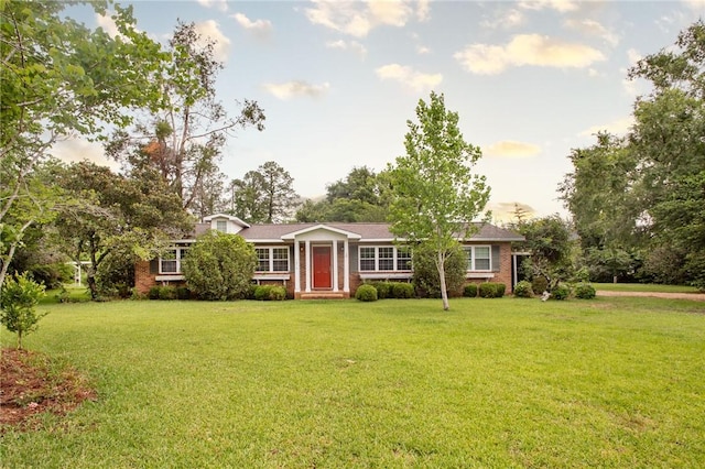1878 Blalock Ave, Waycross, GA 31503 - ranch-style house featuring a front lawn and brick siding