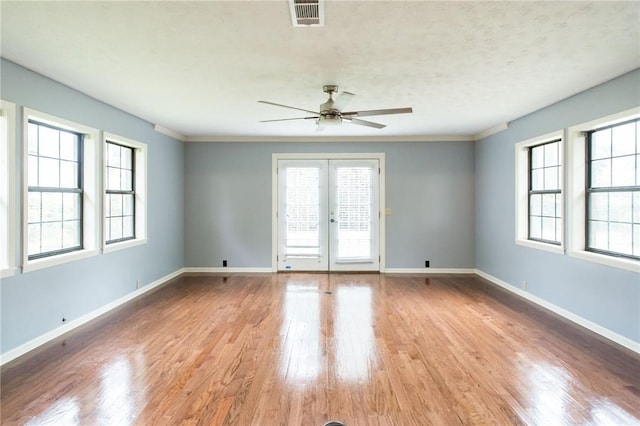 1878 Blalock Ave, Waycross, GA 31503 - unfurnished room with ceiling fan, wood finished floors, baseboards, and french doors