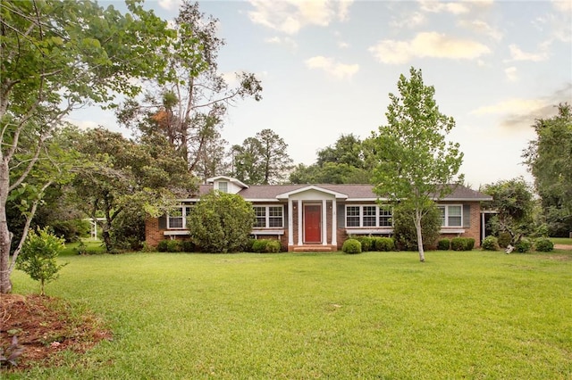 1878 Blalock Ave, Waycross, GA 31503 - ranch-style house featuring a front lawn and brick siding