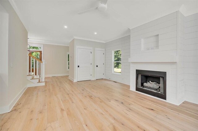 134 Newfield St, Saint Simons Island, GA 31522 - unfurnished living room with a fireplace, wood finished floors, stairs, a ceiling fan, and recessed lighting