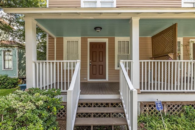 doorway to property with covered porch