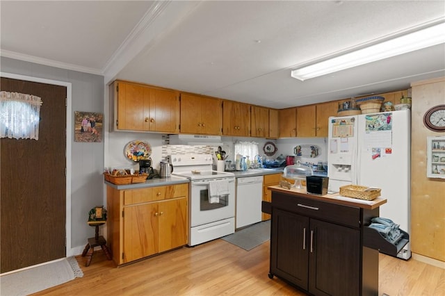 2388 Waycross Hwy, Jesup, GA 31545 - kitchen with white appliances, under cabinet range hood, light wood-style floors, crown molding, and light countertops