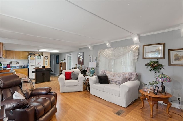 2388 Waycross Hwy, Jesup, GA 31545 - living room with light wood finished floors and crown molding