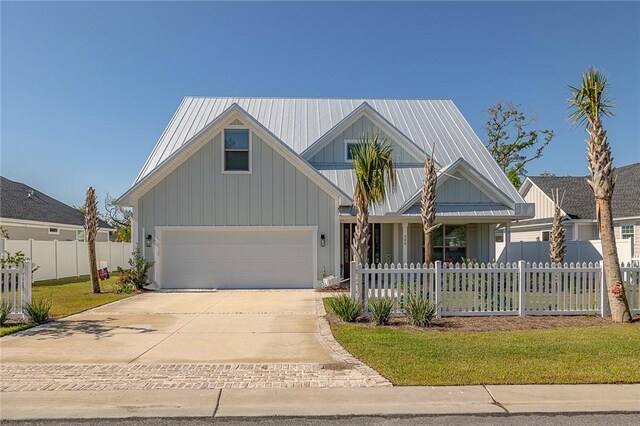 506 Conservation Dr, Saint Simons Island, GA 31522 - view of front facade featuring driveway and board and batten siding