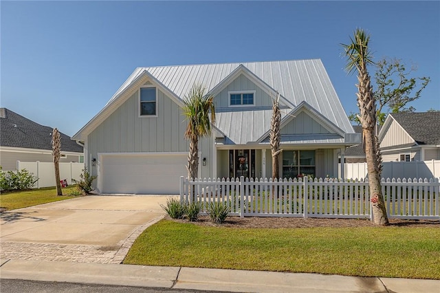 506 Conservation Dr, Saint Simons Island, GA 31522 - craftsman-style house featuring driveway, board and batten siding, and an attached garage