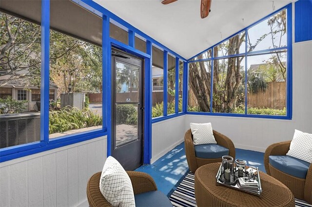 sunroom / solarium featuring ceiling fan and lofted ceiling