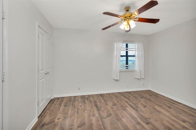 unfurnished bedroom with wood-type flooring and ceiling fan