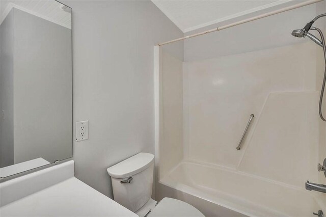 bathroom featuring toilet and bathing tub / shower combination