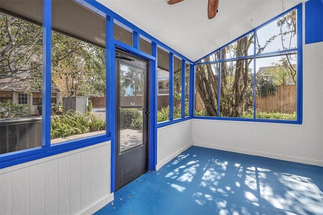 unfurnished sunroom featuring ceiling fan and lofted ceiling