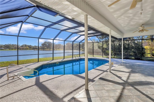 view of pool featuring a lanai, a patio area, ceiling fan, and a water view