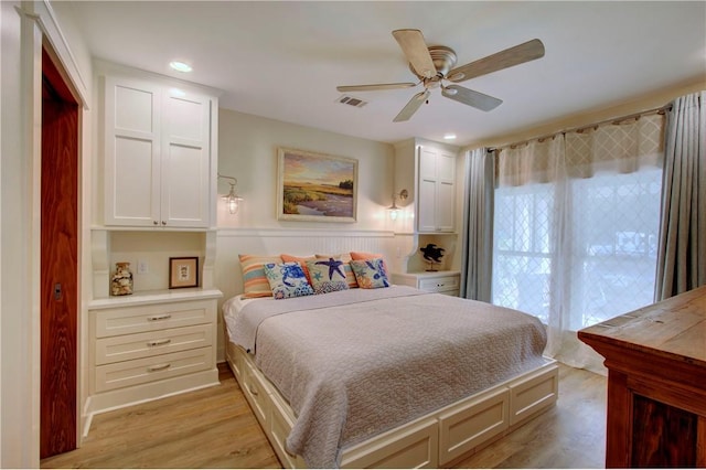 bedroom featuring light hardwood / wood-style floors and ceiling fan