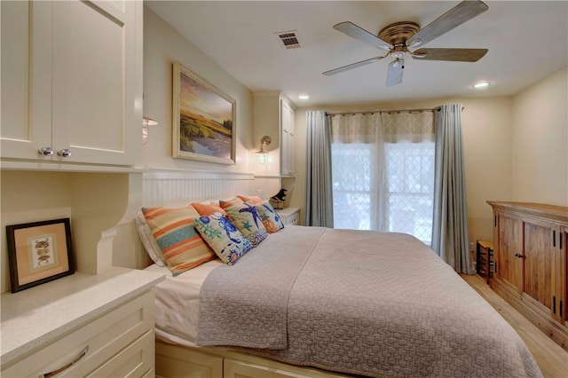 605 Ocean Blvd, Saint Simons Island, GA 31522 - bedroom with light wood-style flooring, a ceiling fan, and recessed lighting