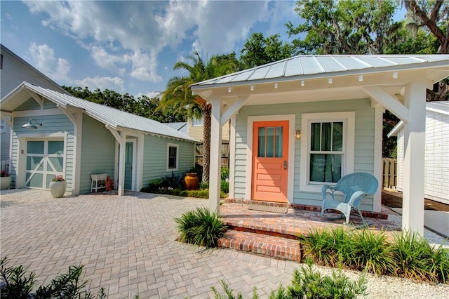 view of front facade featuring a porch and a garage