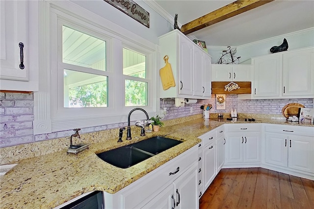 2204 Gibbs St, Waycross, GA 31503 - kitchen featuring white cabinetry, ornamental molding, decorative backsplash, light stone countertops, and beam ceiling