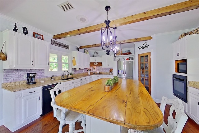 2204 Gibbs St, Waycross, GA 31503 - kitchen featuring black appliances, white cabinetry, decorative backsplash, beam ceiling, and dark wood-type flooring