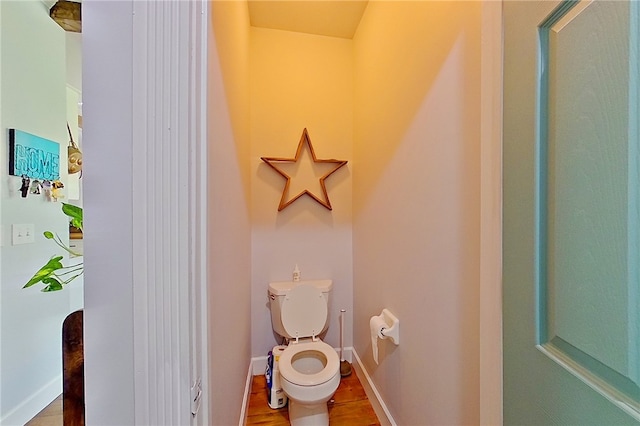 2204 Gibbs St, Waycross, GA 31503 - bathroom featuring toilet and wood finished floors