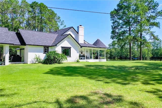 2204 Gibbs St, Waycross, GA 31503 - back of house with a chimney and roof with shingles