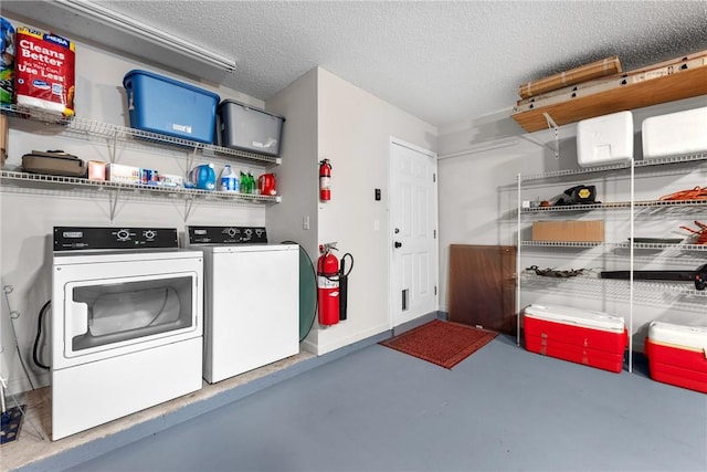 garage with washing machine and clothes dryer